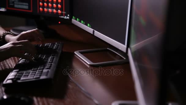 Female hands, fingers typing on keyboard in dark. Woman it professional. — Stock Video