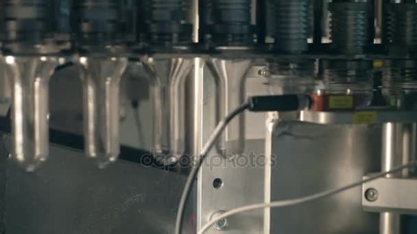 Plastic, PET bottles moving on a conveyor at a plastic bottles production factory. — Stock Video