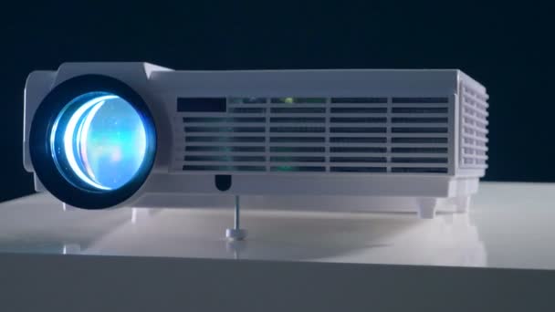 Video, film, TV projector working in a dark room. Close up view. — Stock Video