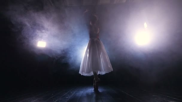 Unrecognised ballet dabcer dancing in the fog. Dolly shot. HD. — Stock Video