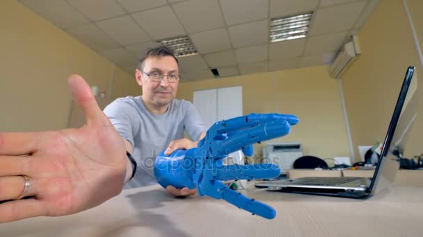 A plastic robotic arm prototype is tested in a lab. — Stock Video