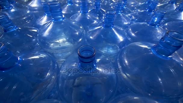 A large field of empty open 5 gallon bottles. — Stock Video