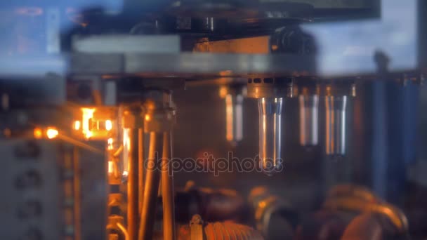 PET bottle preforms moving on rotary wheel. — Stock Video