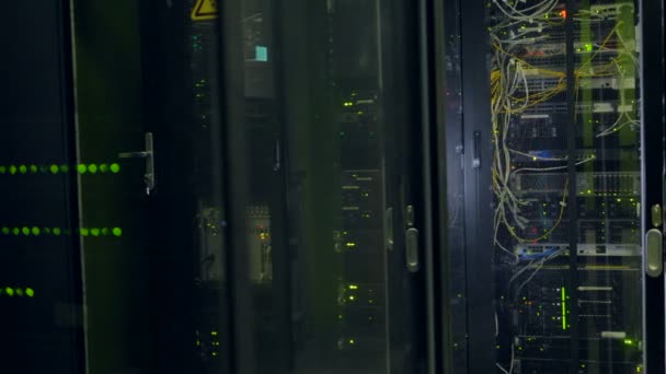 Rows Of Black Network Cabinets With See Through Doors Stock