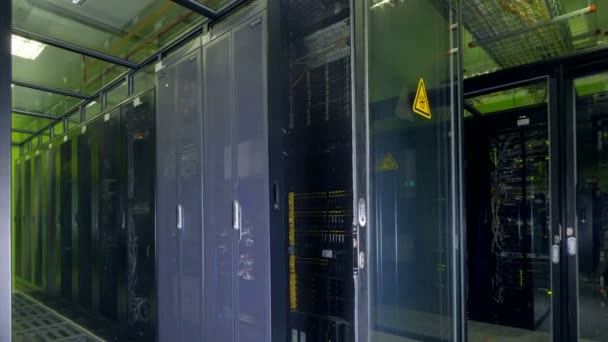 Data center cabinets under glass ceiling. — Stock Video