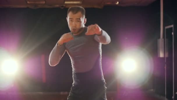 A boxer throws front punches in slow motion. — Stock Video