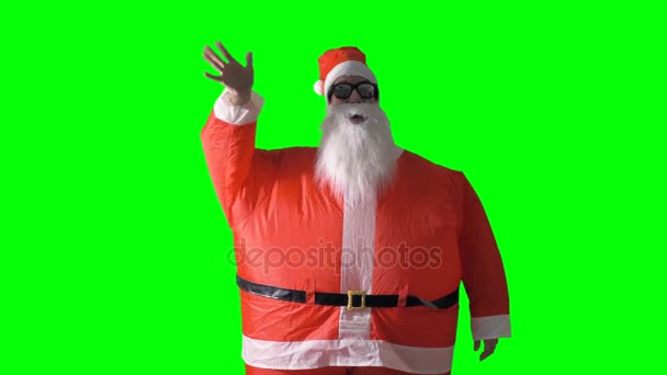 圣诞老人在绿色背景波浪在前面看法. — 图库视频影像
