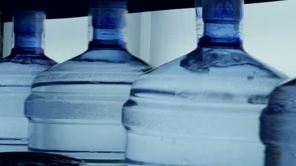 Filled and closed 5 gallon mineral water bottles. — Stock Video