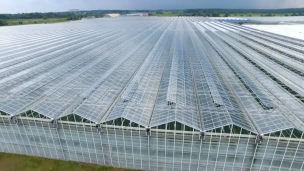 A modern greenhouse with open type roofing. — Stock Video