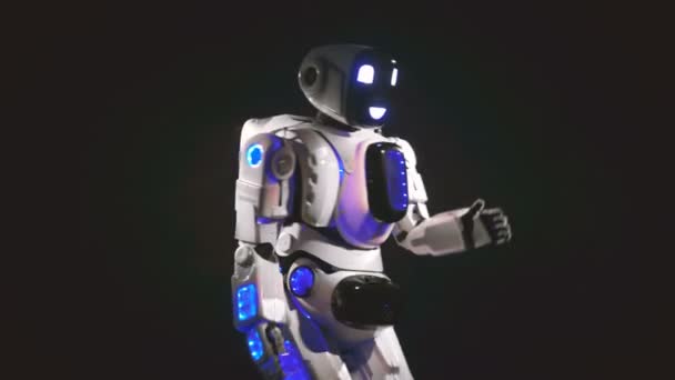 A white android dances in different direction, using its arms. 4K. — Stock Video