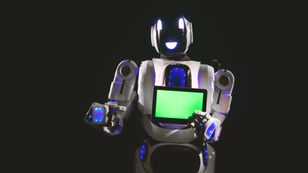 A robot egy zöld képernyő tábla mutatja a kezében. — Stock videók
