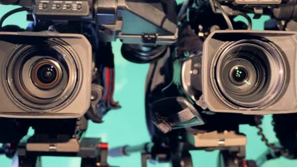 A row of video recorders standing near each other in a studio — Stock Video