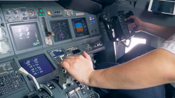 A pilot switches a lever and steers, close up. — Stock Video