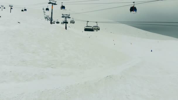 Cable cars are moving along the cableway in the mountains — Stock Video