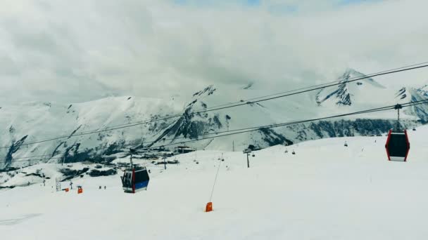 Cable cars are moving in the mountain landscape. Ski lift in the mountains. — Wideo stockowe