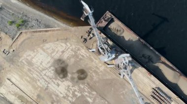 Top view of mechanical loaders turning around