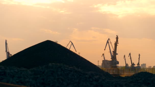 Industrial site with a pile of gravel at sunset — Stock Video
