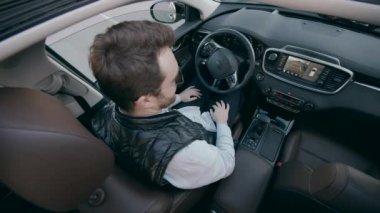 A man in the cab of an automatic car