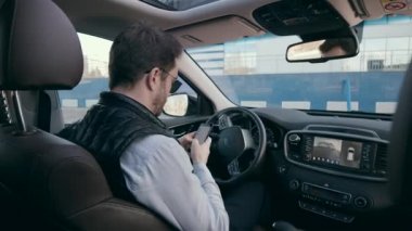 Car cab of an automatic vehicle with a male driver inside