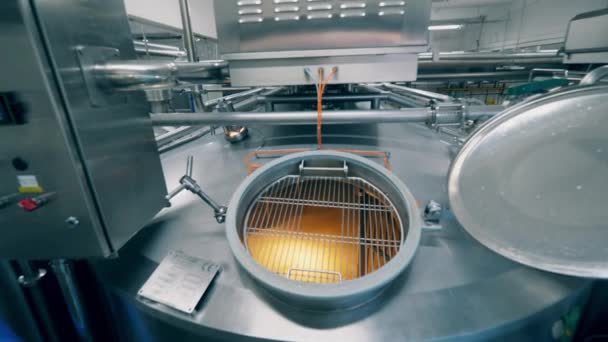 Cheese production process. Metal cistern with dairy substance getting cooked in it — Stock Video