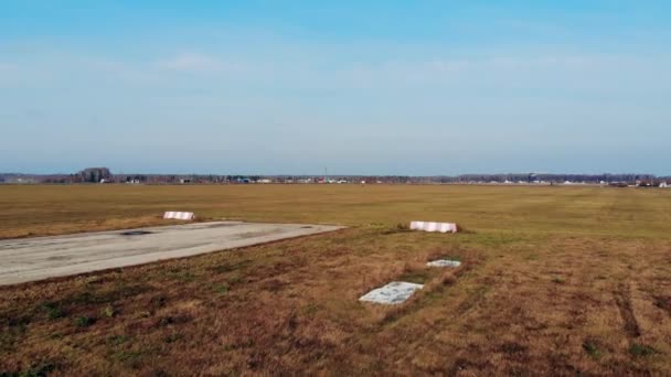 Small jet is landing onto the old aerodrome runway — 비디오