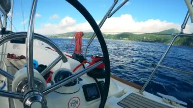 Navigation panel of a boat with blue water around it