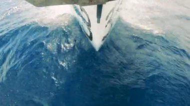 Front view of a boat crossing the sea waters