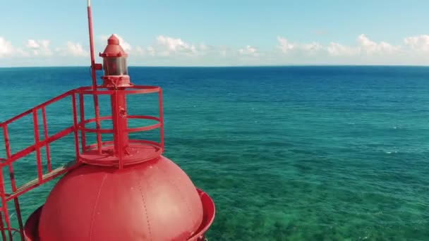 Beacon on a blue sea background. — Stock Video