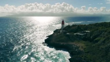 High lighthouse near blue sea.