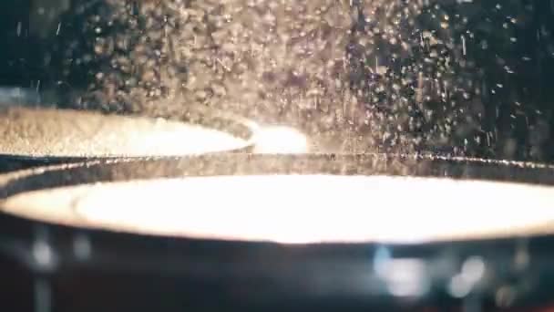 Drummer plays, hitting drums with water on it. — Stockvideo