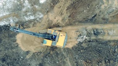 Industrial machine, excavator moves stones at a career.