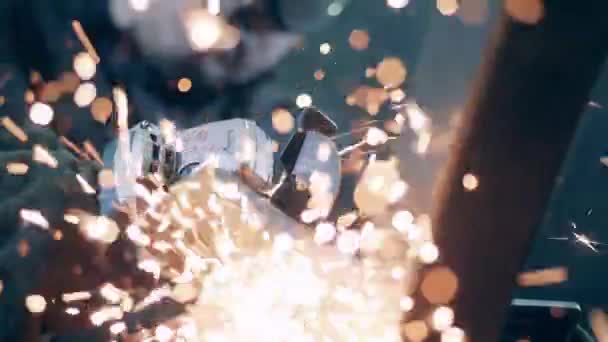 A worker uses angle grinder while cutting metal. Metal cutting process wirh lots of grinding sparks. — 비디오