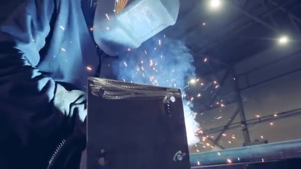 One person uses welding machine at a plant. — 비디오