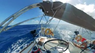 Round first-person view from a sailing vessel with ladies on it
