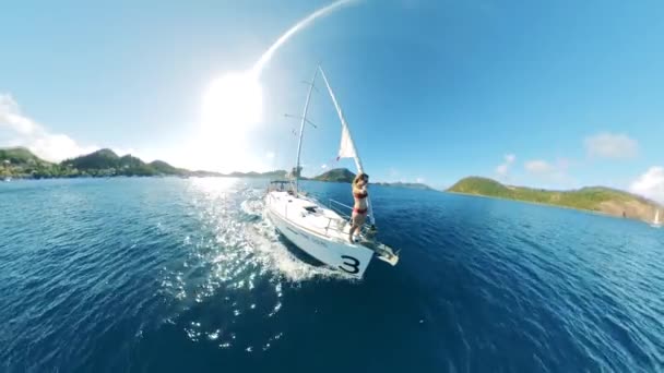 Sailing vessel with a woman remote-filming herself onboard. Friends on a sailing boat during summer vacation, sea adventure. — 비디오