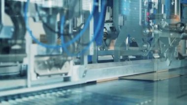 Mechanical conveyor is making cardboard boxes