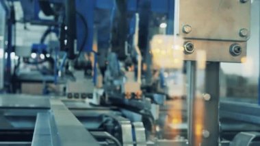Factory machine is processing cardboard sheets