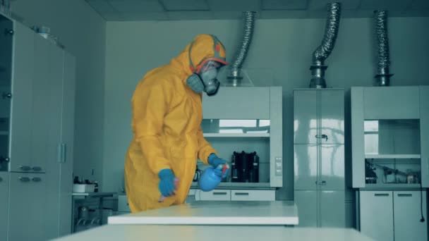 Laboratory room with a table getting sanitized by a disinfector during COVID-19 outbreak. — Stock Video