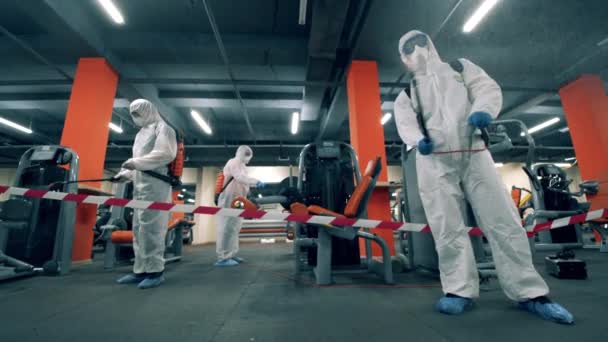 Gym is getting pulverized with chemicals by the disinfectors — Stock Video