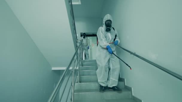 Disinfection experts are chemically sanitizing the stairs — Stock Video