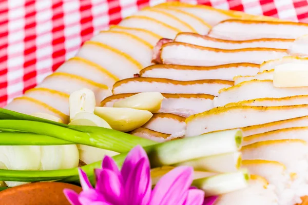 Salted lard with garlic and onion — Stock Image Salted lard with garlic and onion Royalty Free Stock Photos