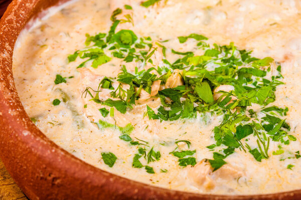 Chicken with vegetables baked in sour cream. Georgian cuisine