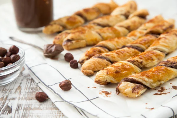 homemade cakes - puff pastry with chocolate paste. twisted cakes with chocolate.