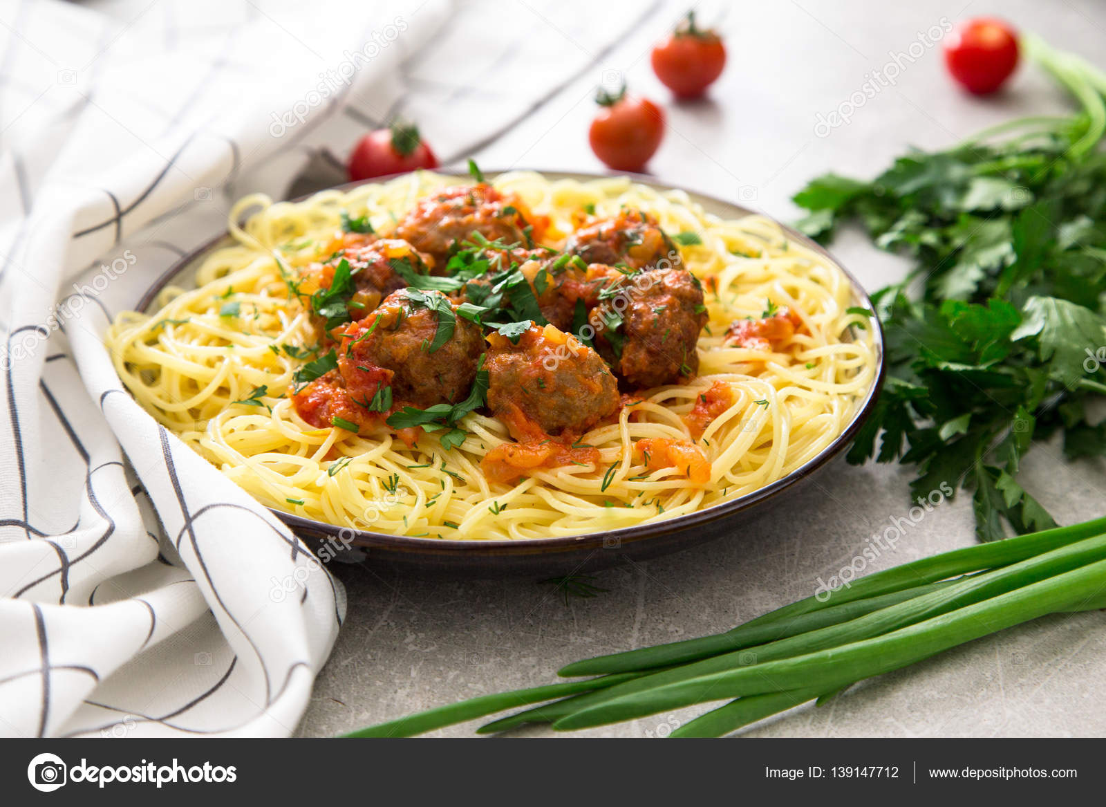 Spaghetti pasta with meatballs and parsley with tomato sauce Stock