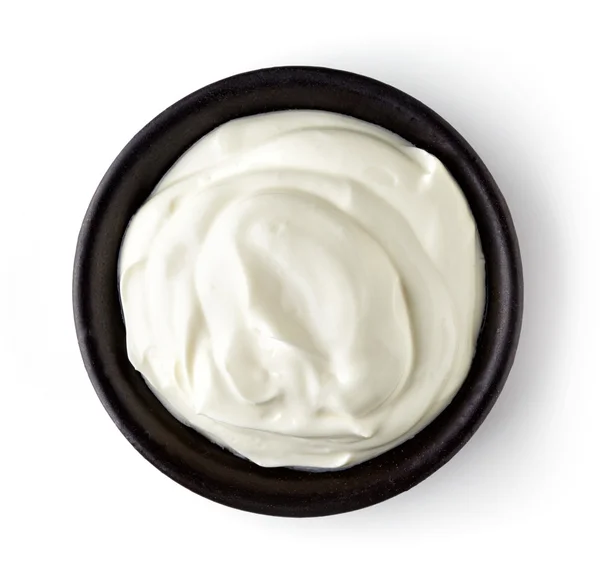 Kom met de crème geïsoleerd op een witte achtergrond, van bovenaf — Stockfoto