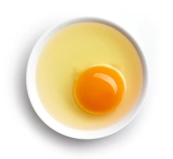 Bowl of egg yolk isolated on white, from above — Stock Photo, Image