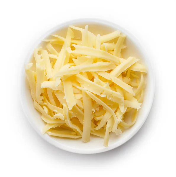 ボウルの上からすりおろしたチーズ — ストック写真