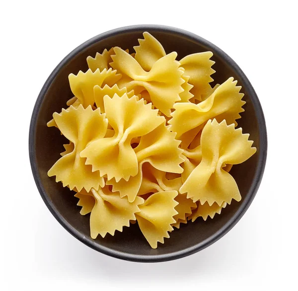 Pasta en un tazón aislado sobre blanco, desde arriba — Foto de Stock