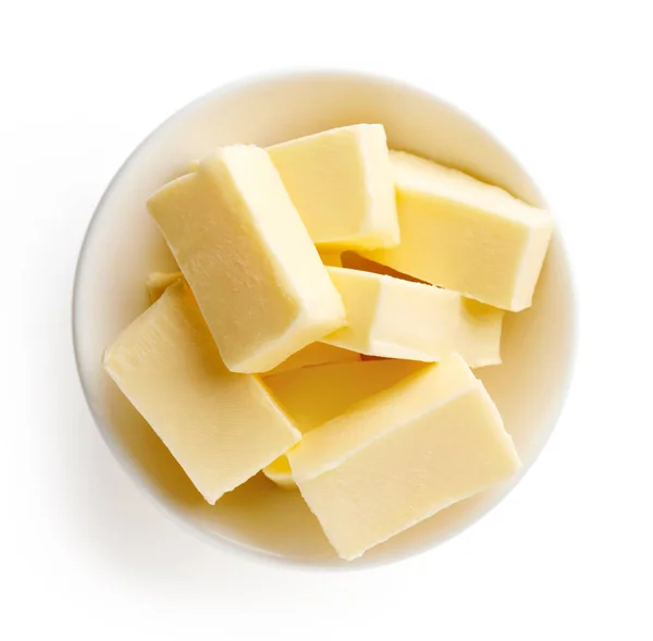 Skål med smör på vit bakgrund — Stockfoto