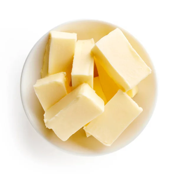 碗里的黄油涂在白色背景上 — 图库照片